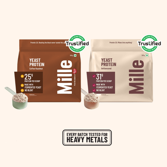 Two bags of Mille Yeast Protein powder by Trustified are shown side by side on a light beige background. The left bag is dark brown and labeled 'Mille Coffee Flavour' with 25g protein per scoop, and the right bag is light beige and labeled 'Mille Delightful' with 31g protein per scoop.
