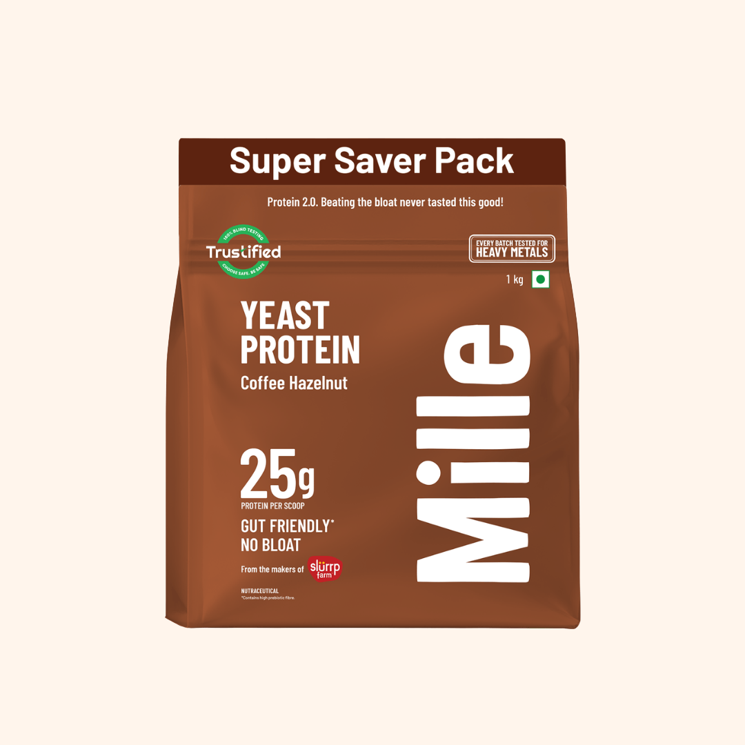 A 1 kg bag of Mille Yeast Protein Coffee Hazelnut in the Super Saver Pack, shown on a solid cream background.