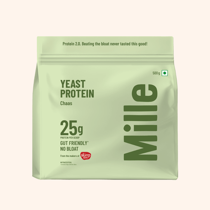 A 500g stand-up pouch of Mille Yeast Protein Chaas on a light beige background. The packaging is a pale sage green with dark green text and a small red 'duper' logo near the bottom.